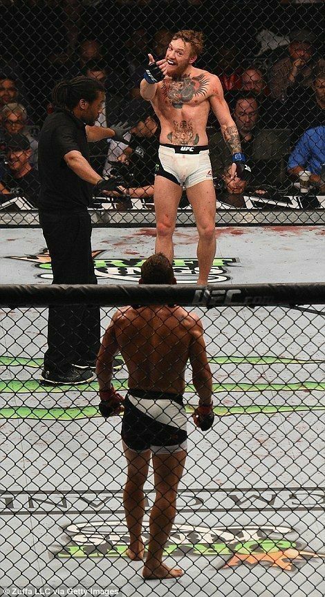 Conor McGregor standing in UFC octagon after a fight